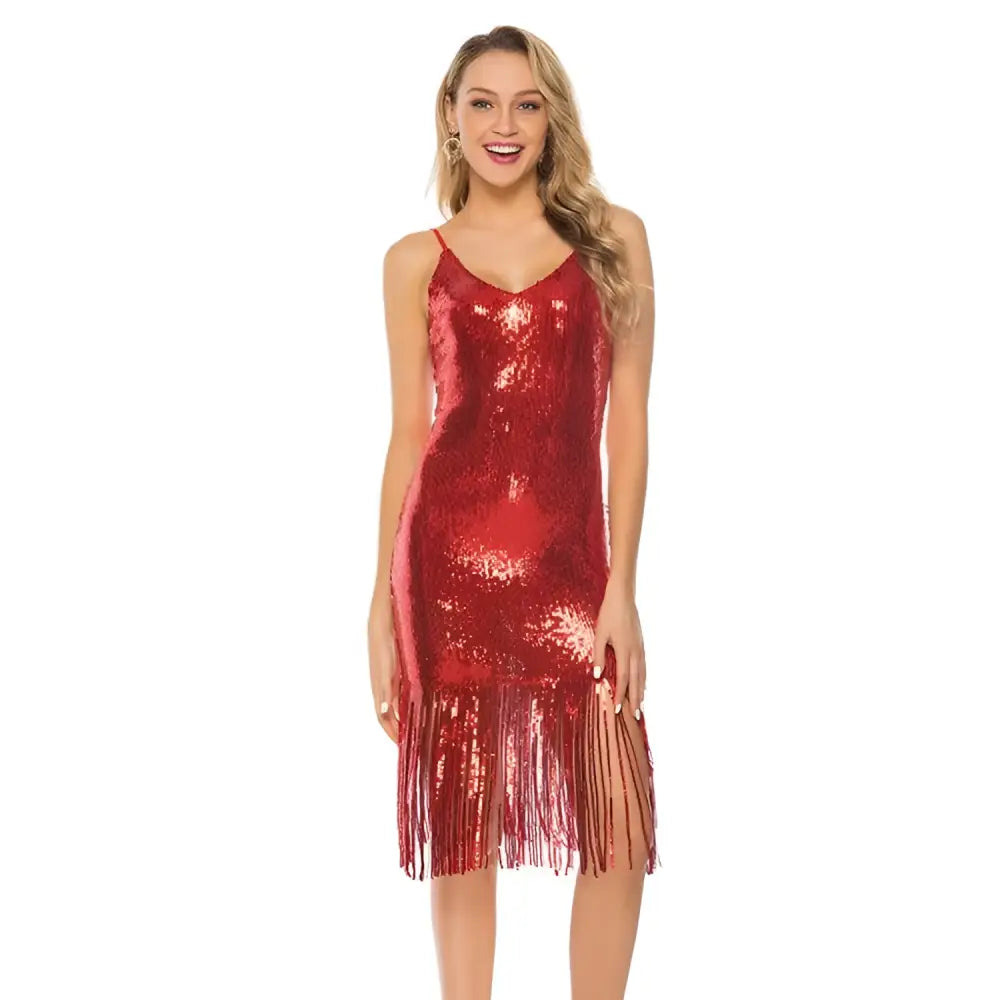 A shimmering red sequined fringed backless slip dress with v-neckline and fringe detailing along the hem