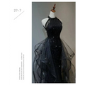 Black sequined halter neck evening dress with a layered sheer tulle skirt for formal occasions