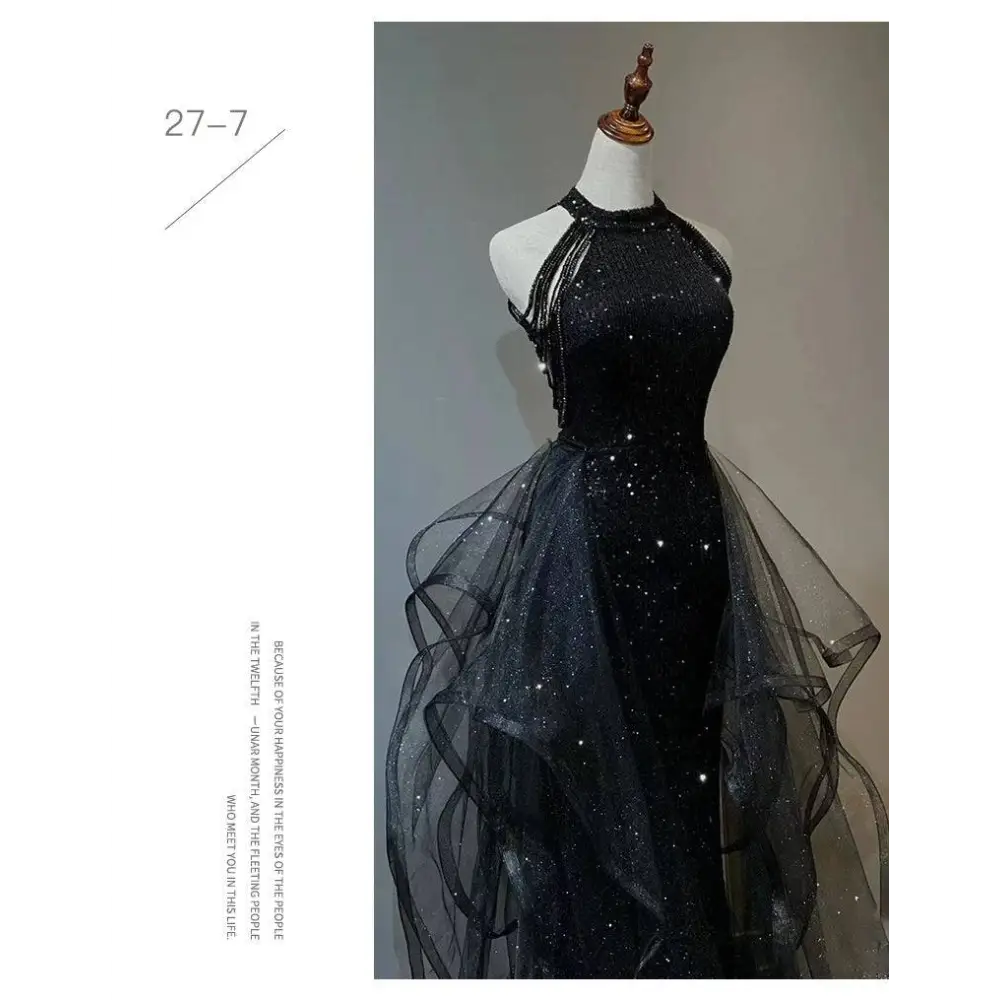 Black sequined halter neck evening dress with a layered sheer tulle skirt for formal occasions