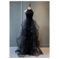 Black evening dress featuring a sequined halter neck and layered sheer tulle skirt with elegant tulle layers