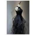 Black evening dress with sequined halter neck and layered sheer tulle skirt for elegant formal occasions