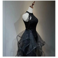 Black sequined halter neck evening dress with layered sheer tulle skirt and delicate beaded straps