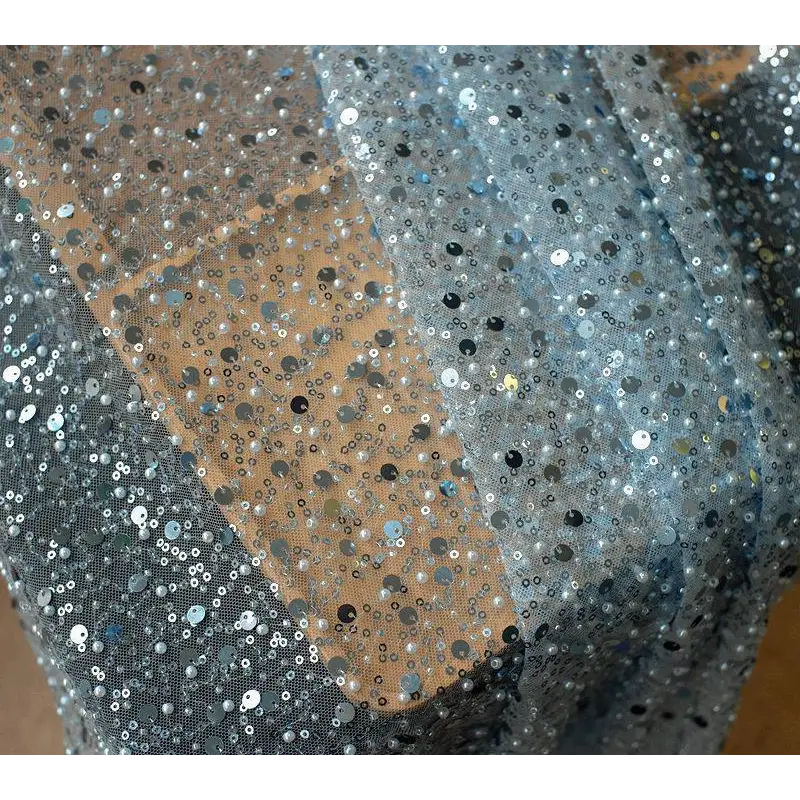 Sheer lace asymmetric dress featuring pearl embroidery lace with densely packed silver and black sequins detailing