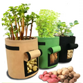 Set of 3 fabric planting bag potato grow bags in beige green and black with windows showing harvested potatoes inside