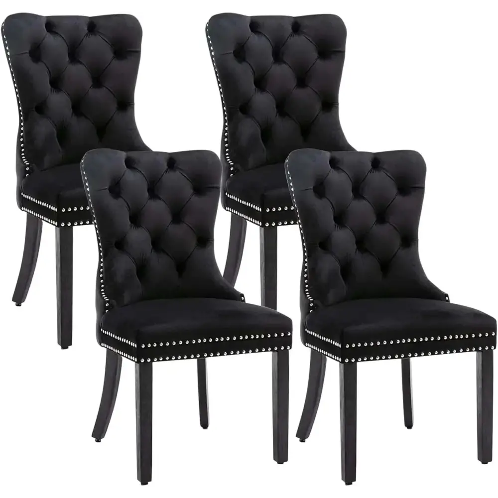 Set of 4 black velvet tufted dining chairs with silver nailhead trim featuring velvet fabric upholstery