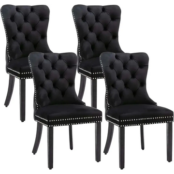 Set of 4 black velvet tufted dining chairs with silver nailhead trim featuring velvet fabric upholstery
