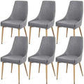 Set of 6 gray upholstered dining chairs with modern design and light wood legs ideal for dining room decor