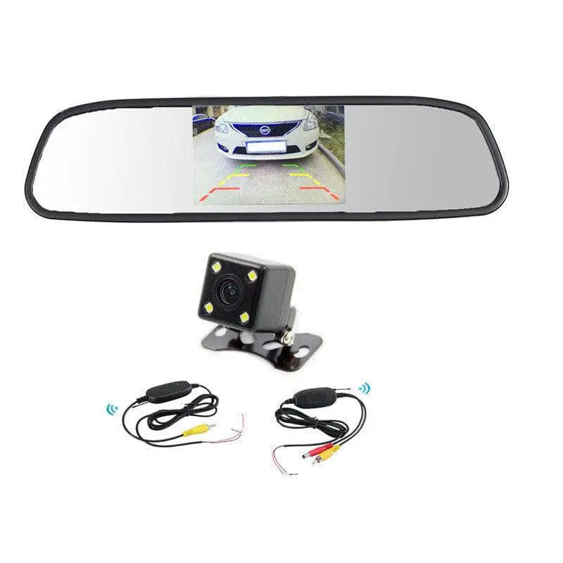 Black seven-inch wireless rear view camera system with red led lights and analog signal monitor displaying a truck