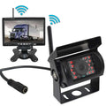 Black seven-inch wireless rear view camera system with red led lights and analog signal monitor displaying a truck