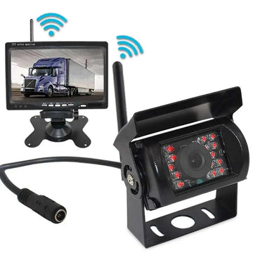 Black seven-inch wireless rear view camera system with red led lights and analog signal monitor displaying a truck