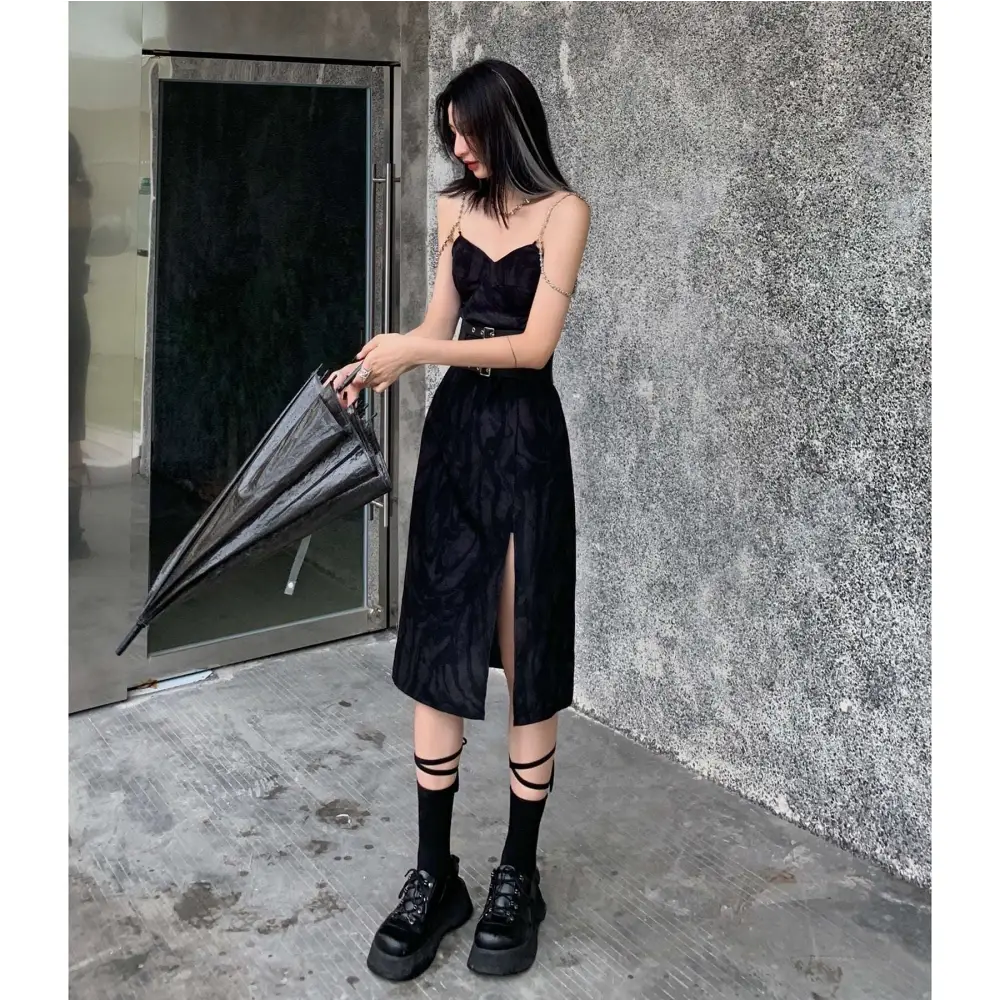 Black velvet midi dress with sweetheart neckline and side slit paired with white leopard print chain satin slip dress