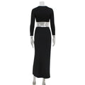 Black long-sleeved crop top and high-waisted skirt set featuring a sexy navel leopard print long sleeve dress suit design