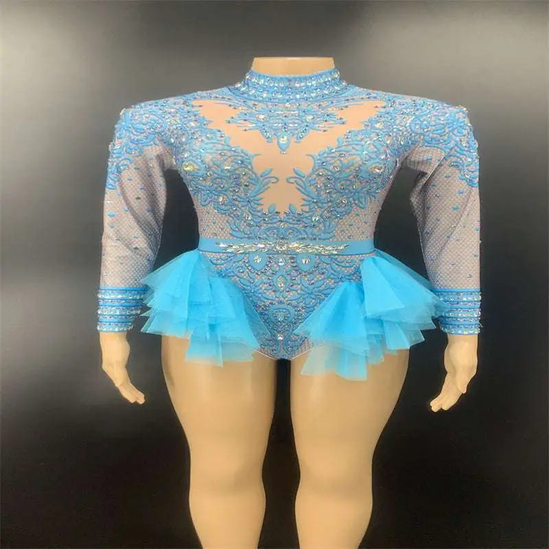 A sparkling pink sequined shiny rhinestone mesh leotard with ruffled skirt and matching headpiece for performance