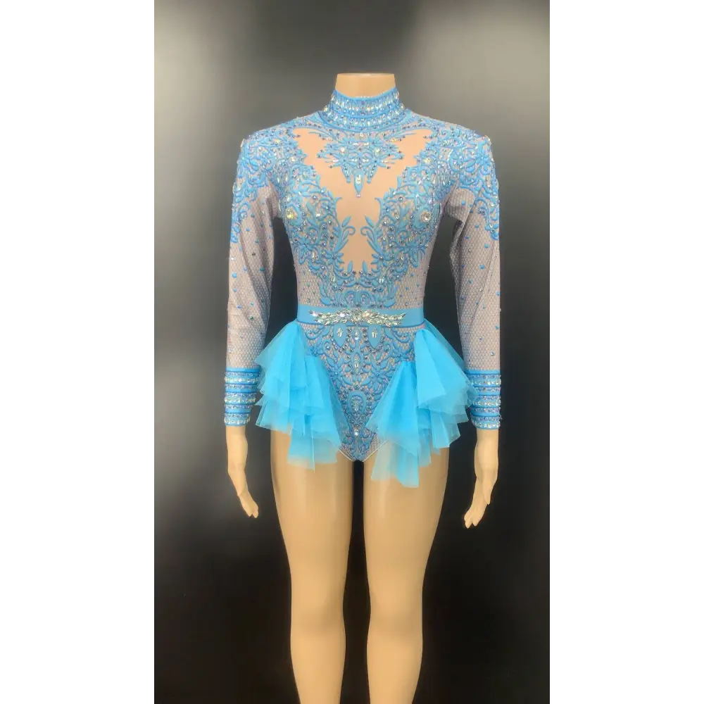 A shimmering light blue shiny rhinestone mesh performance leotard with intricate beading and layered tulle ruffles