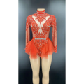 A vibrant orange shiny rhinestone mesh performance leotard with intricate beading, mesh sleeves, and a flared tulle skirt
