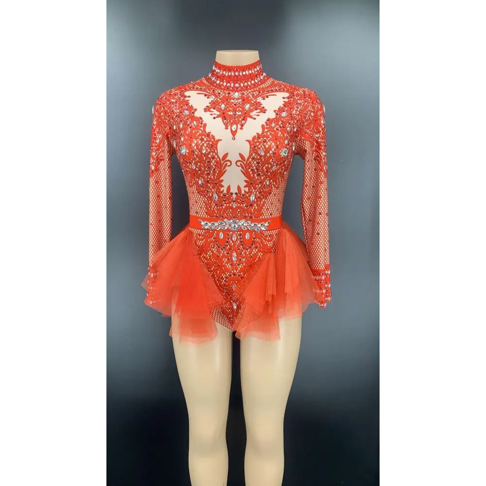 A vibrant orange shiny rhinestone mesh performance leotard with intricate beading, mesh sleeves, and a flared tulle skirt