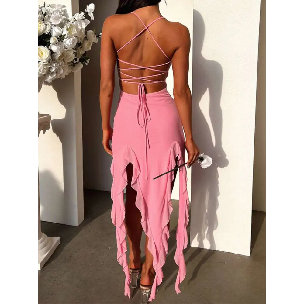 A pink sexy suspender tight dress with slim skirt design featuring a high slit and ruffled hem for elegant wear