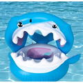 Blue inflatable shark seat ring with white teeth and purple inner seat designed as a shark seat swimming ring with awning