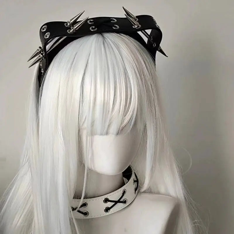 Black sharp claw kitty leather rivet headband with silver spikes and eyelets worn over white synthetic hair