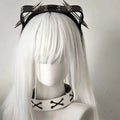 Black leather rivet headband with silver spikes and white lace-up choker from sharp claw kitty leather collection