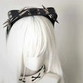 Black leather rivet headband with silver-toned spikes and circular accents from sharp claw kitty leather collection