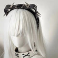 Black leather rivet headband with silver-toned spikes and metal eyelets from the sharp claw kitty leather collection