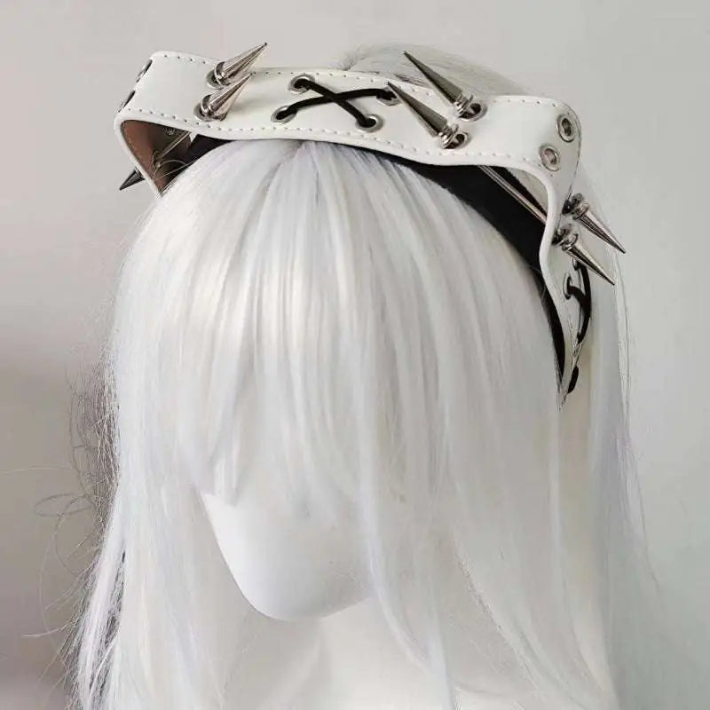 White leather rivet headband from the sharp claw kitty leather collection with silver spikes and black lace-up details