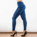 Dark blue high-waisted denim jeans with distressed knee rips and form-fitting design shascullfites melody blue ripped lifting jeggings