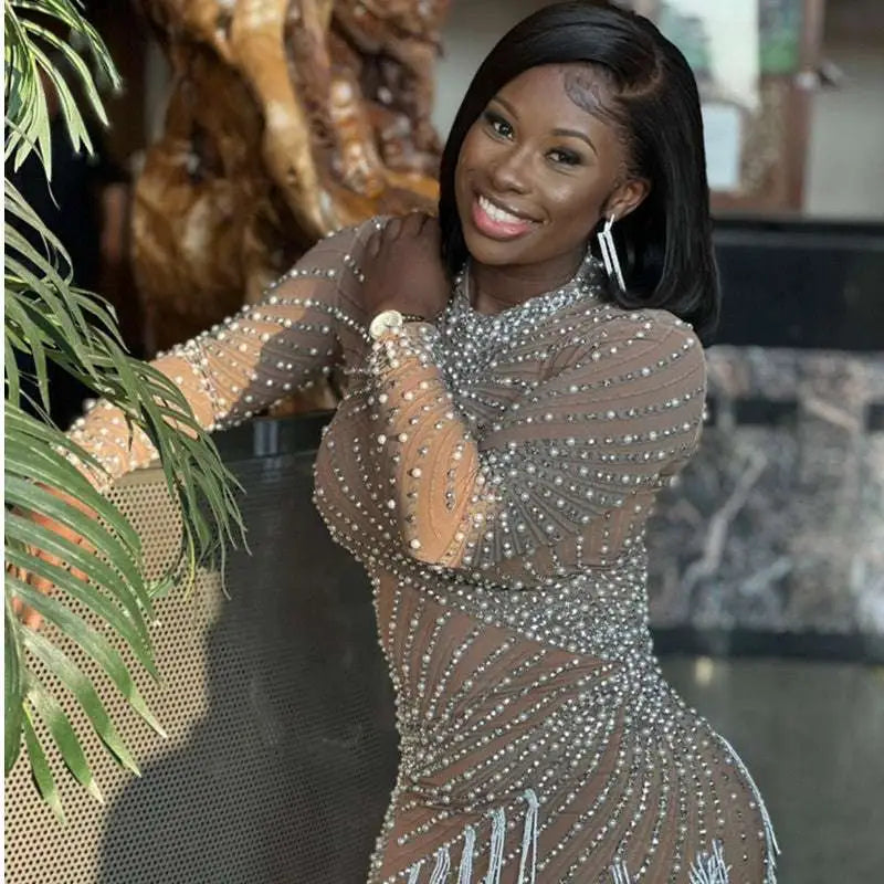 Sheer beaded tassel dress in nude with silver beading and white fringe detailing for dress birthday party events