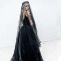 Black veil made of sheer tulle with delicate lace headpiece for a sheer bride wedding black veil ensemble