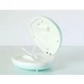 A pastel blue and white circular alarm clock with hinged lid showing internal mechanism for shell rainbow projection use