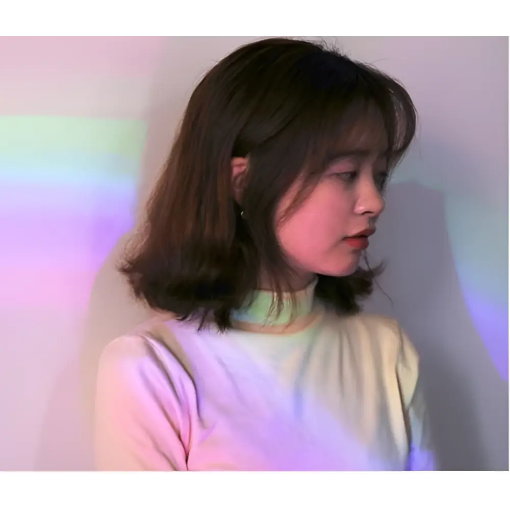 Shell rainbow projection hair removal light with a soft pastel pink and pale yellow high neck sweater gradient design