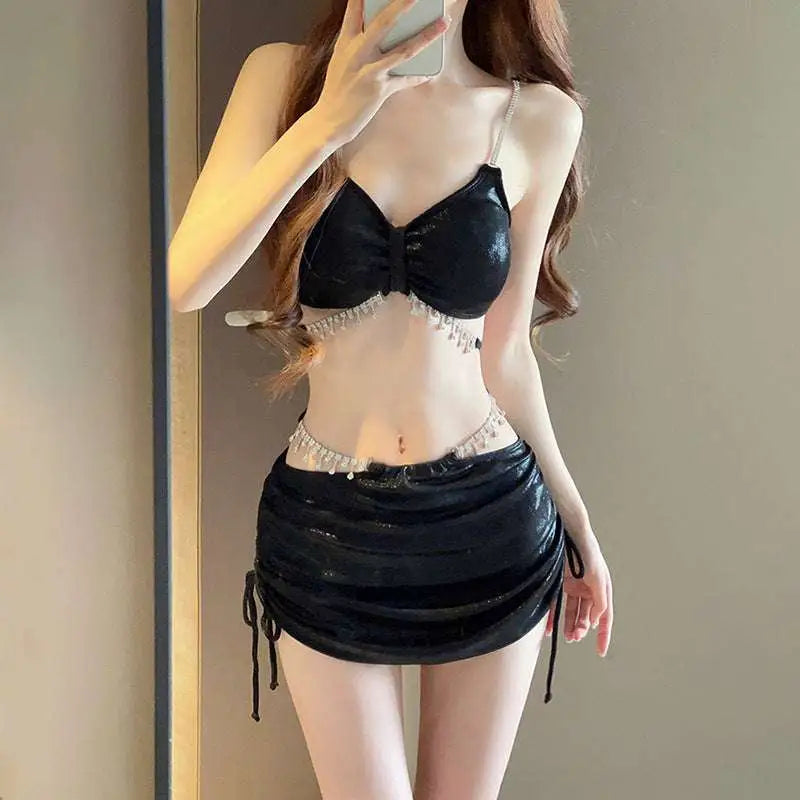 Black sequined bikini top with crystal embellishments and matching ruched skirt in luxury women’s fashion