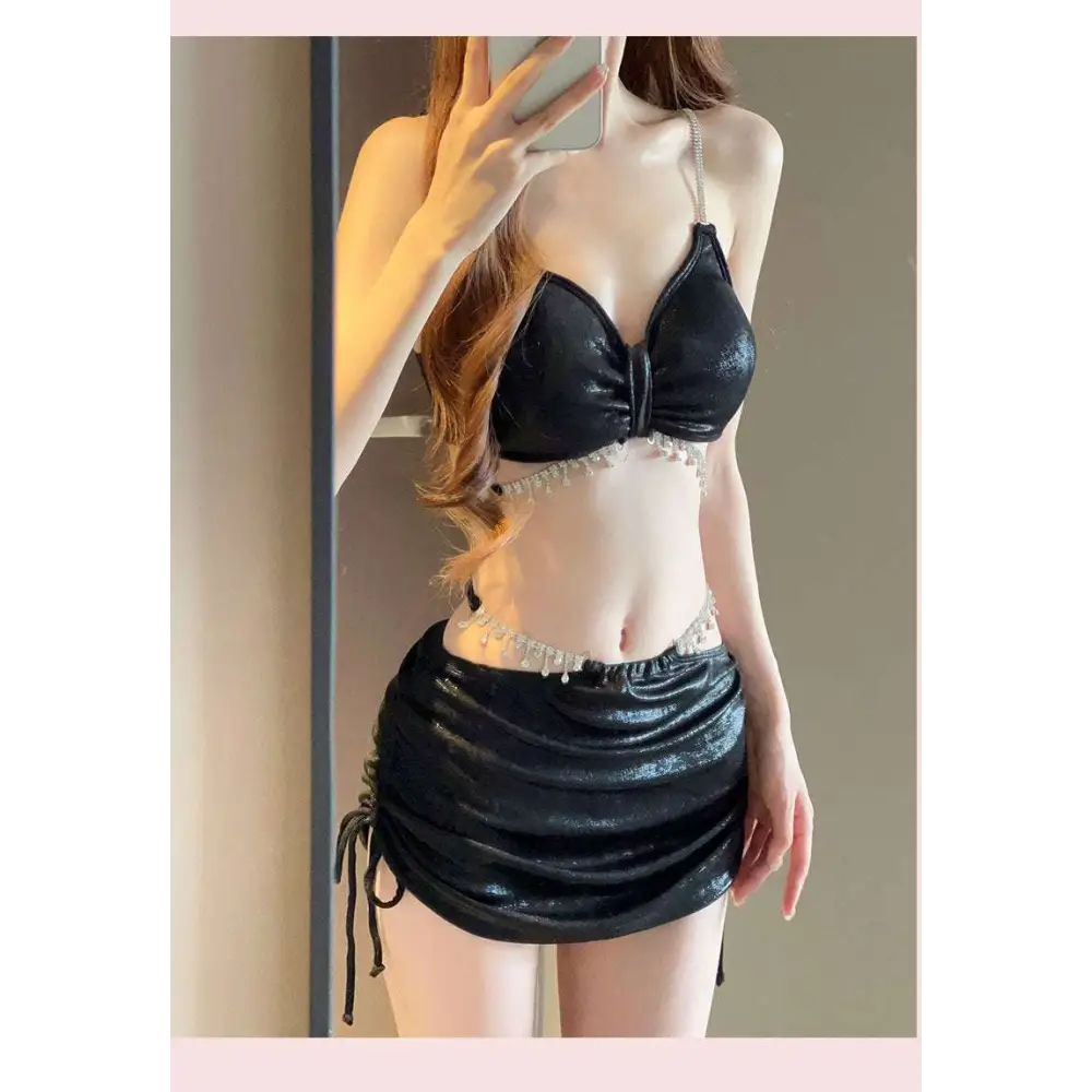 Black shimmering velvet two-piece swimwear set with pearl embellishments for luxury women’s fashion beachwear