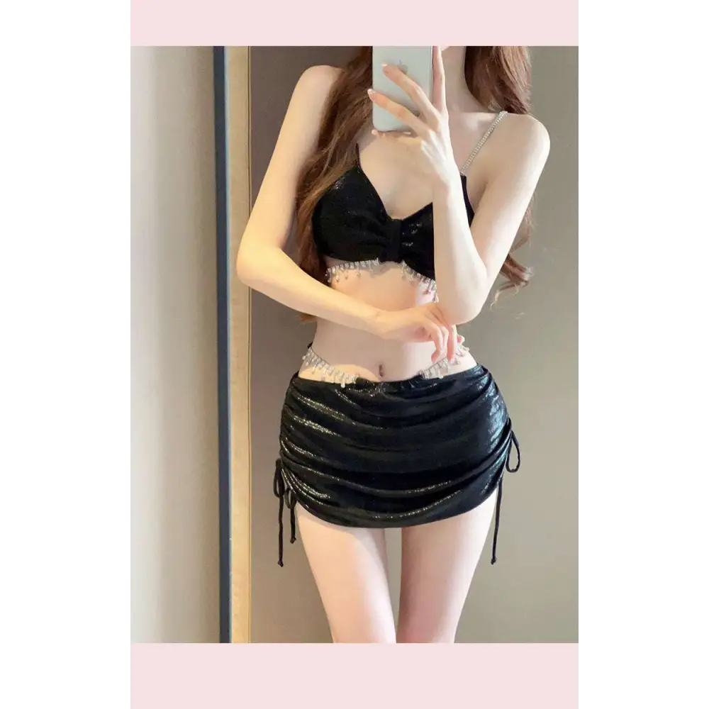 Black sequined belly dance outfit with bow front top and ruched skirt contrasting luxury women’s fashion style