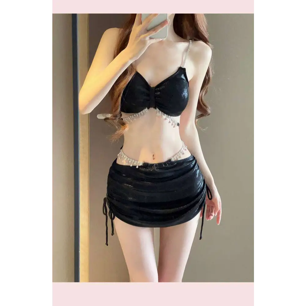 Black sequined bikini top with bow detail and crystal embellishments in luxury women’s fashion shimmering pink satin set