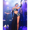 Black shiny rhinestone tube slit skirt bandage suit featuring emerald and silver starburst embellishments