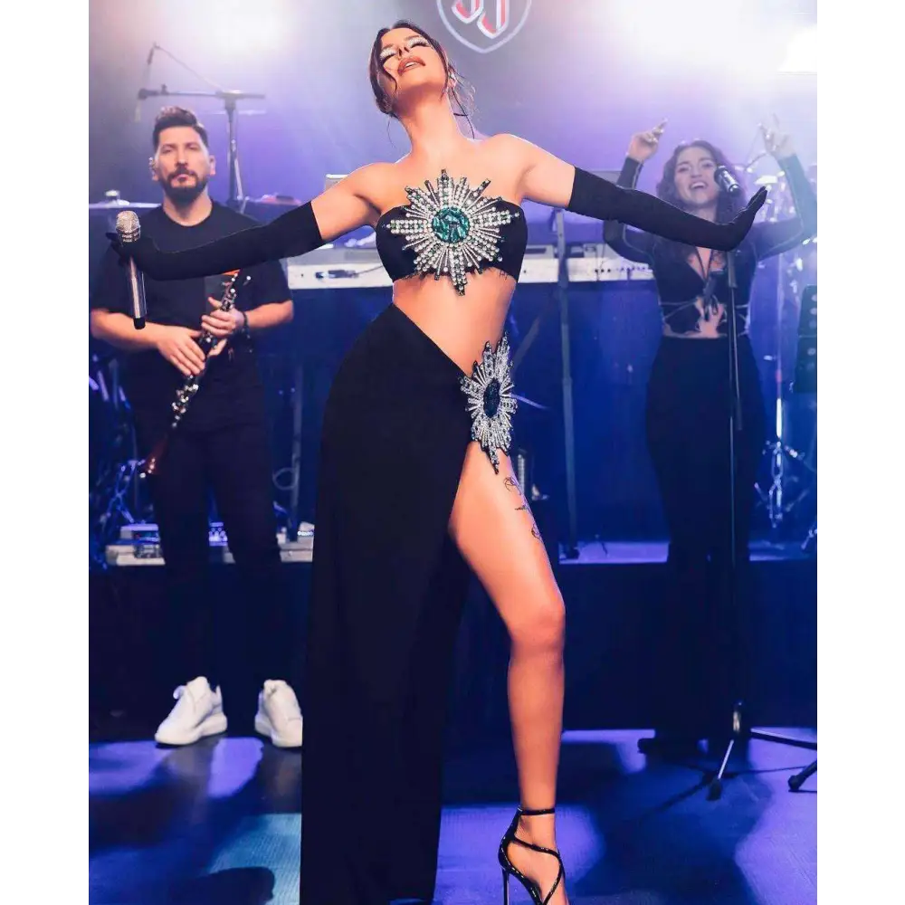 Black strapless shiny rhinestone tube skirt bandage suit with emerald center and high slit skirt bandage design