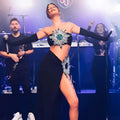 Black strapless shiny rhinestone tube bandage suit with radiant starburst bodice and matching slit skirt bandage design