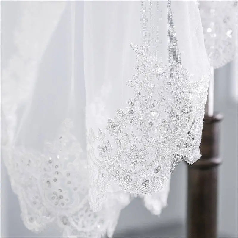 Short veil soft mesh sequined lace white ivory with delicate floral patterns draped elegantly over a mannequin head