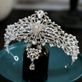 Silver baroque bride crown with crystals and pearls featuring intricate filigree and clear teardrop crystals