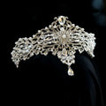 Silver baroque bride crown adorned with clear crystal and pearl accents featuring an ornate floral design