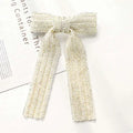 Silver beaded bow hair clip in cream with woven texture and sparkling glass diamond embellishments for elegant styling