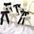 Elegant silver beaded bow hair clip with black and white beads mesh and pearl detailing with glass diamonds