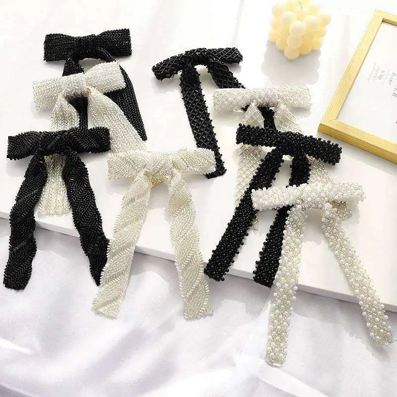 Elegant silver beaded bow hair clip with black and white beads mesh and pearl detailing with glass diamonds