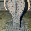 A shimmering silver beaded sexy elegant fishtail gown with intricate blue crystal embellishments in diamond pattern