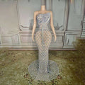 A shimmering silver beaded sexy elegant fishtail gown with fitted bodice and flowing train adorned with diamond embellishments