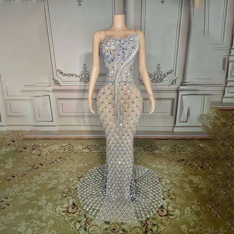 A shimmering silver beaded sexy elegant fishtail gown with fitted bodice and flowing train adorned with diamond embellishments