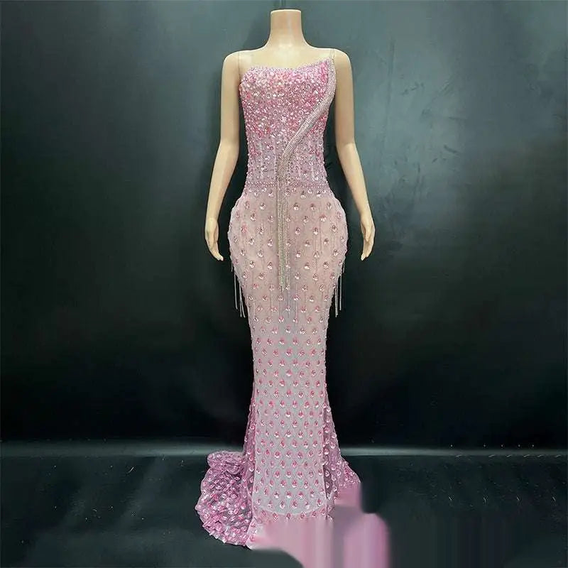 A shimmering silver beaded sexy elegant fishtail gown in pink with intricate beading and delicate fringe detailing