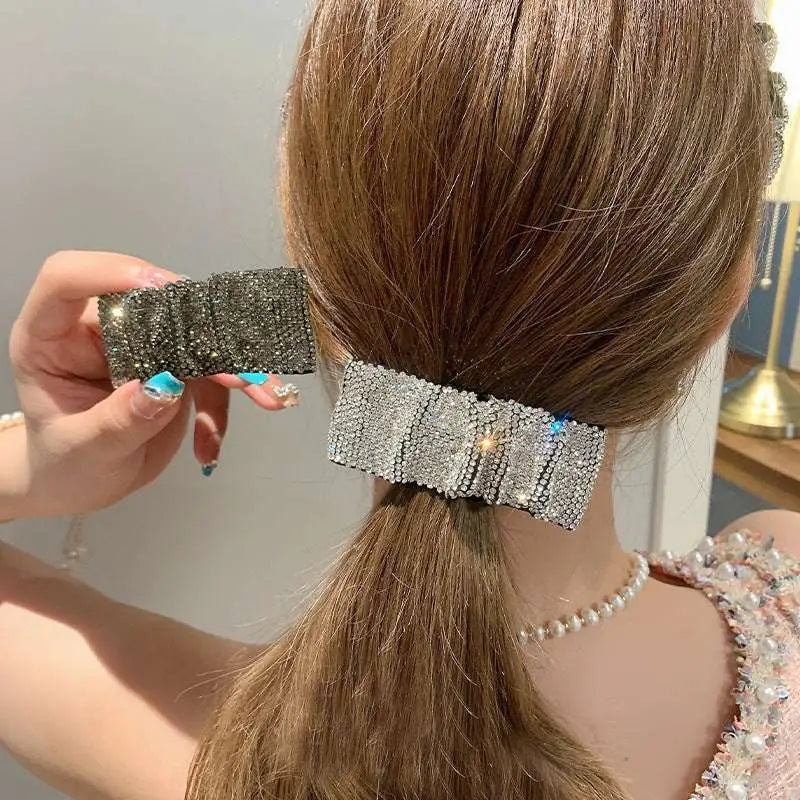 Silver bow pleated bb clip featuring hot rhinestone details with a sparkling silver rectangular design
